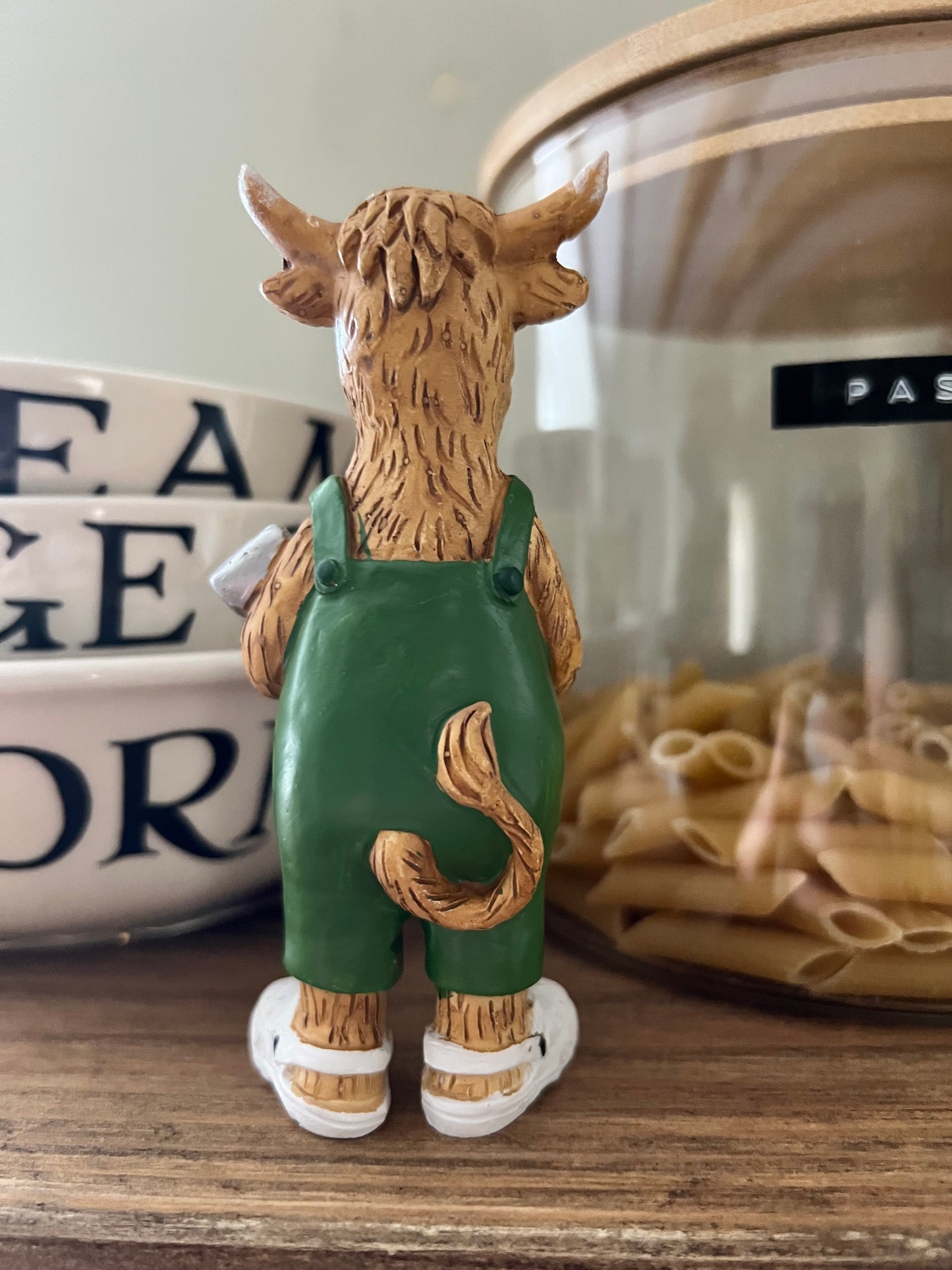 Highland Cow Holding Shovel